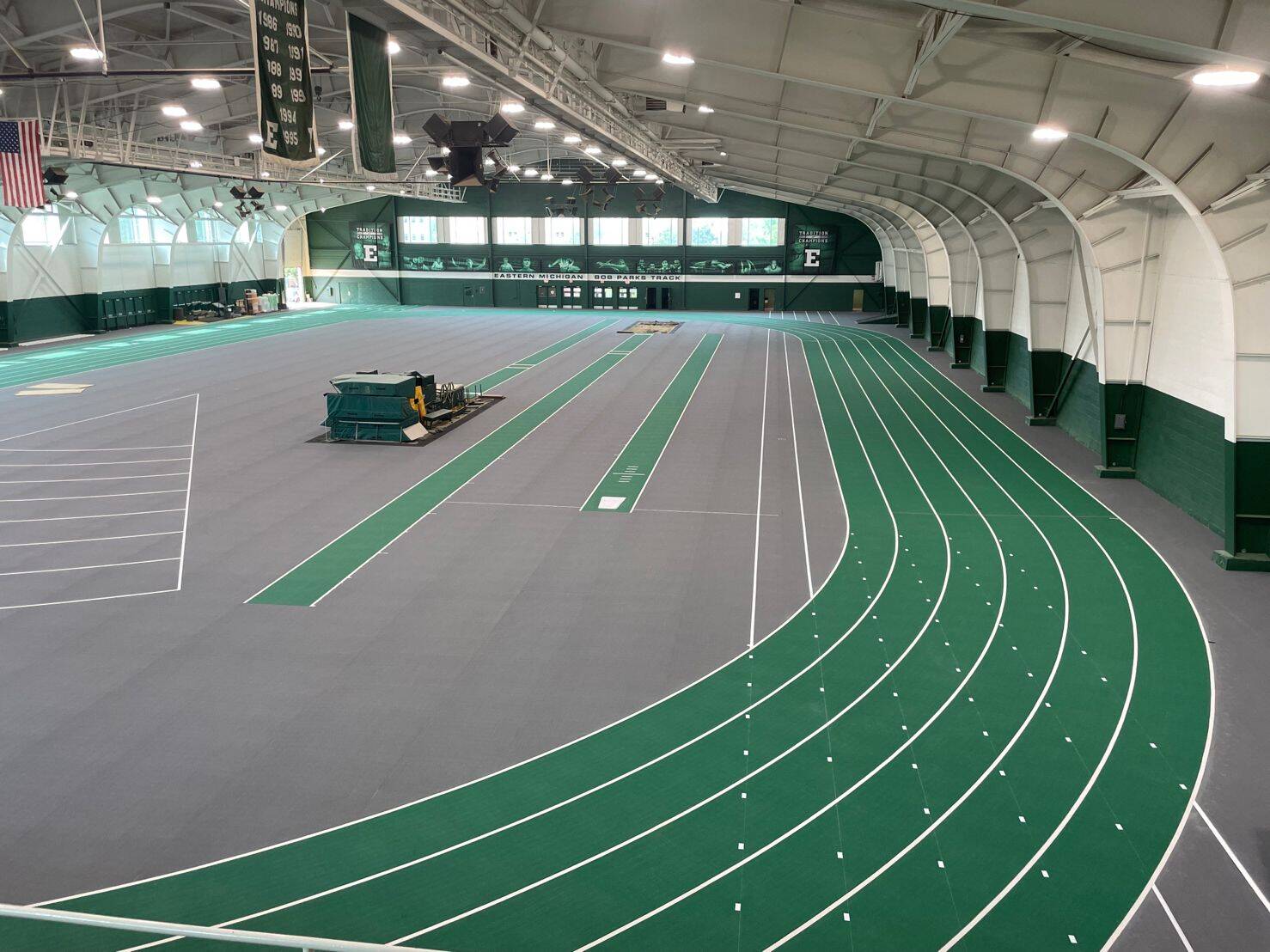 Beautifully designed track and field track that showcases a green theming and emphasizes commercial flooring