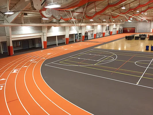 Commercially floored orange track surrounding the basketball court of Bowling Green State University