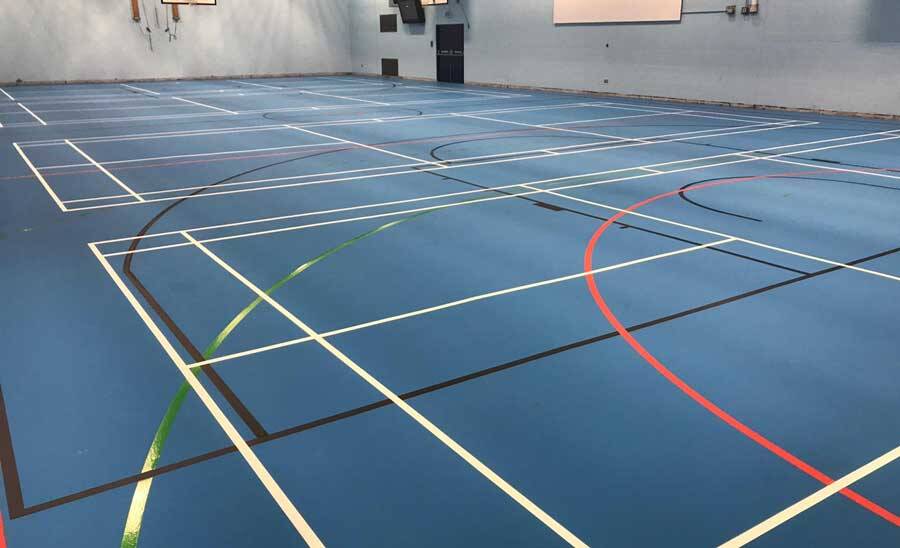 Blue Vinyl sport flooring of a court that can be used for basketball and other sport purposes